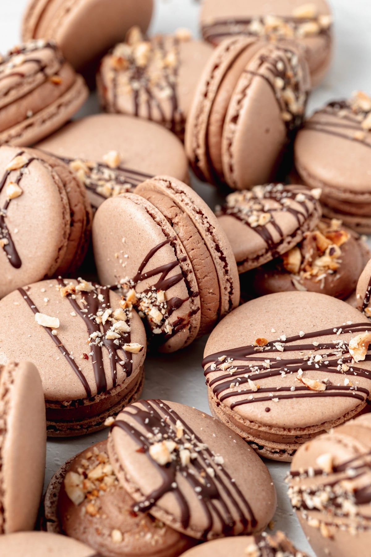 side shot of chocolate hazelnut macarons with nutella