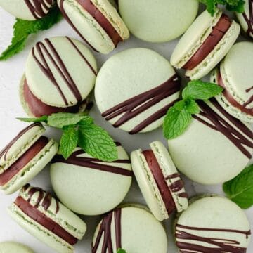 close up of mint chocolate macarons