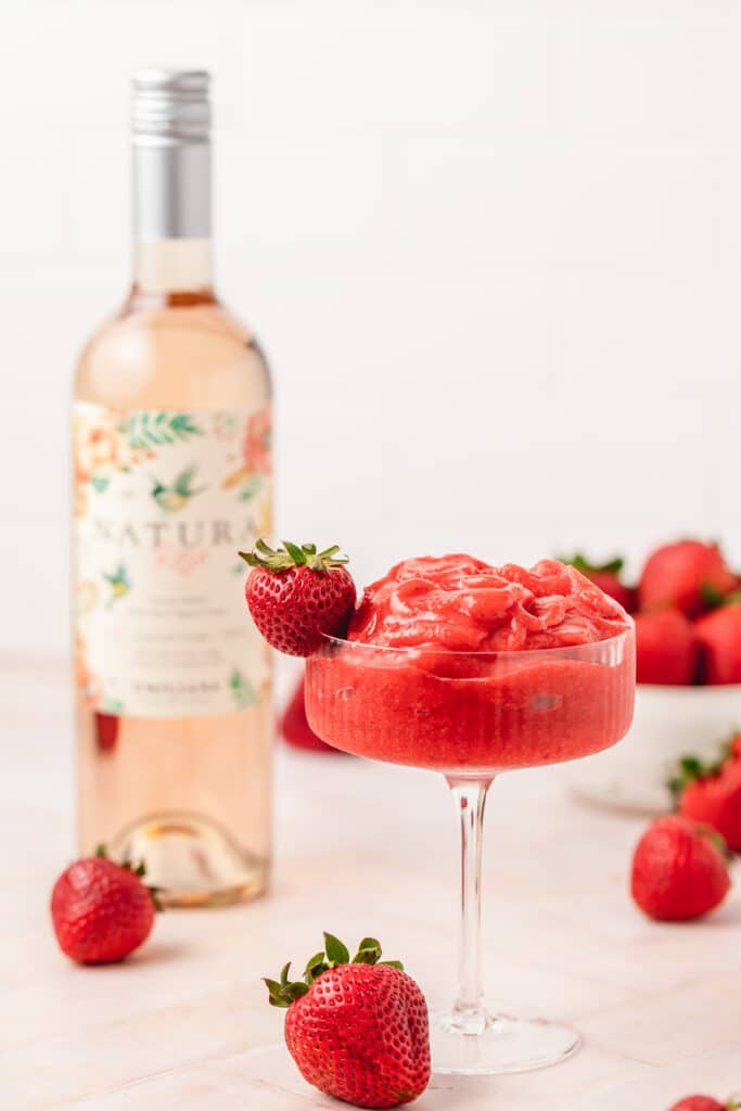 strawberry frosé with bottle of rosé in the back