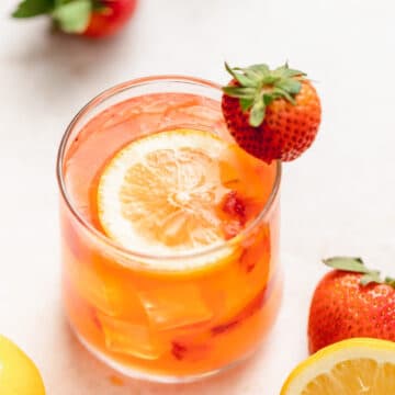 spiked strawberry lemonade with fresh strawberries