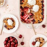 fresh cherry almond crisp with vanilla ice cream and scoop missing for featured