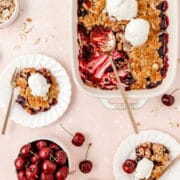 fresh cherry almond crisp with vanilla ice cream and scoop missing for featured