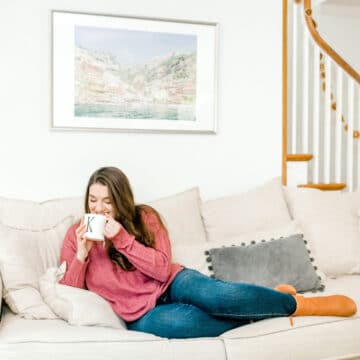 kyleigh of barley and sage sitting on couch