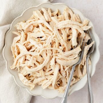 close up of shredded poached chicken