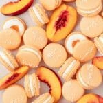 close up of peach macarons with whipped cream