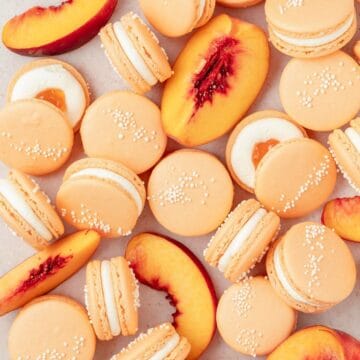 close up of peach macarons with whipped cream