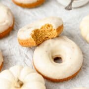 close up of brown butter baked pumpkin donuts