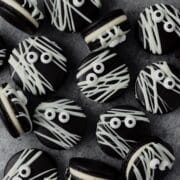 close up of black cocoa mummy macarons