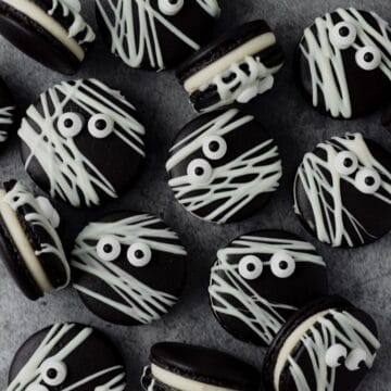 close up of black cocoa mummy macarons