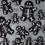 close up of black cocoa skeleton shortbread cookies