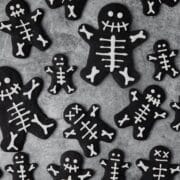 close up of black cocoa skeleton shortbread cookies