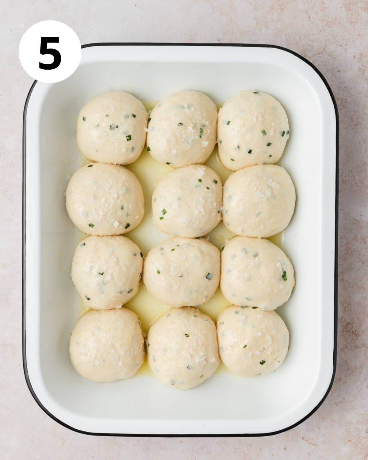 sour cream chive rolls brushed with butter before baking