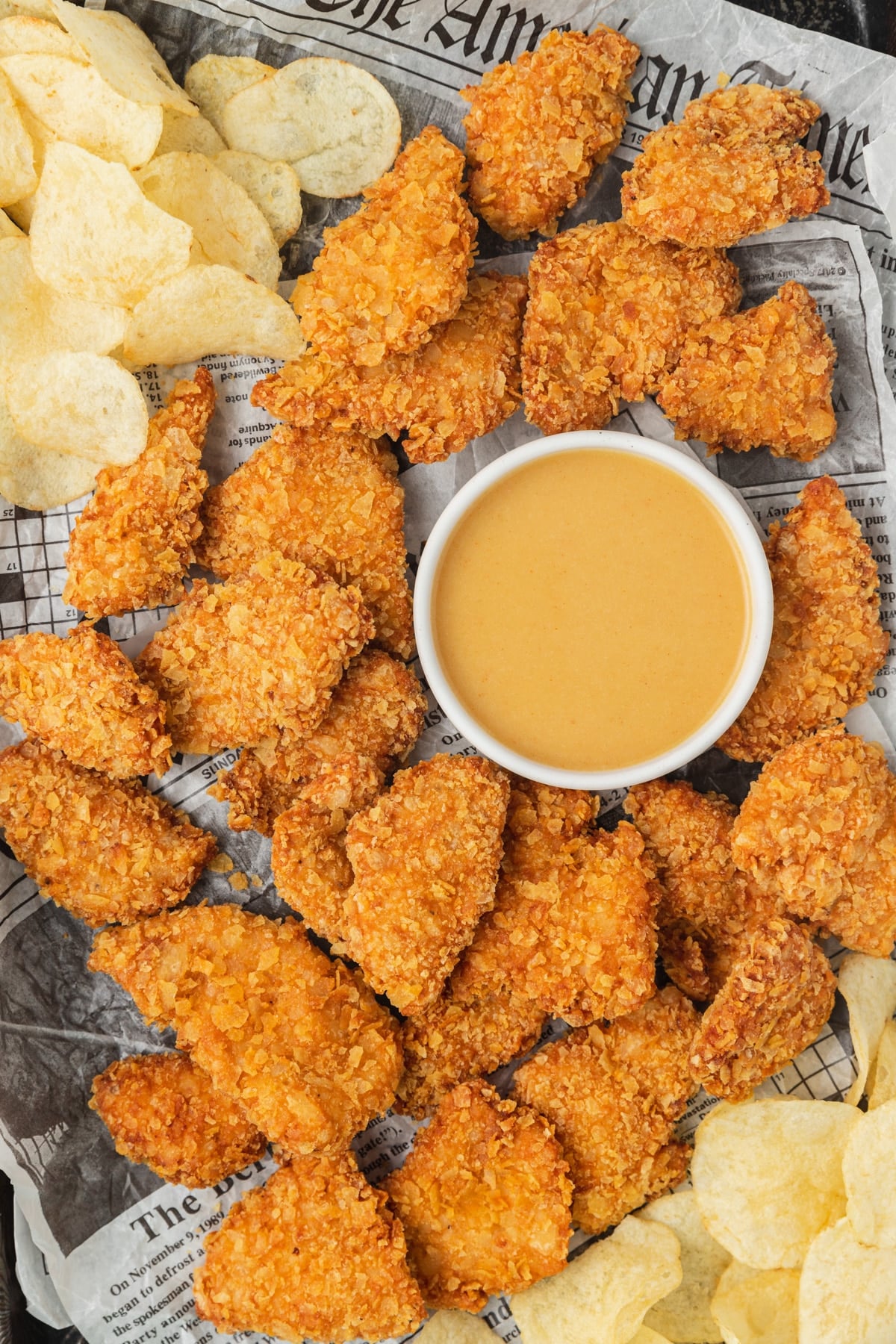 potato chip chicken tenders on baking sheet