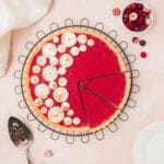 close up of cranberry curd tart with toasted meringue