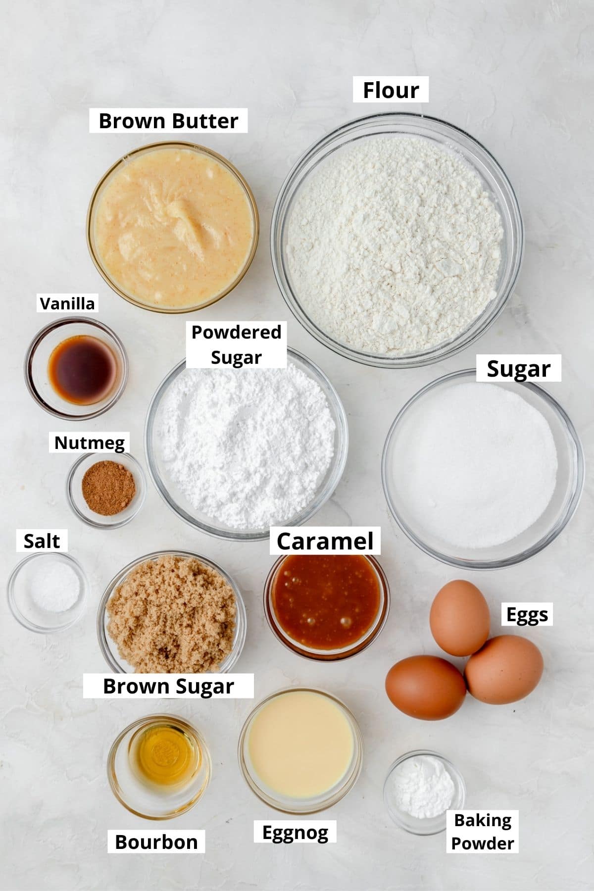 labeled shot of eggnog layer cake ingredients