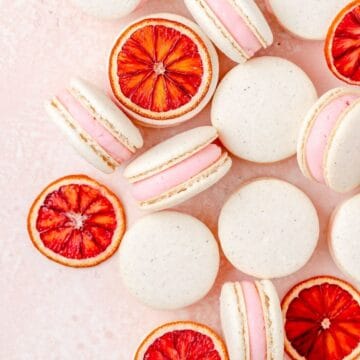 close up of cardamom blood orange macarons