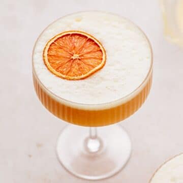 close up of cara cara orange whiskey sour