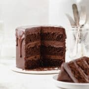 super close up of triple chocolate layer cake with chocolate drip.