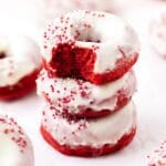 close up of red velvet baked donuts with cream cheese frosting.