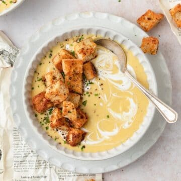 close up of creamy potato leek soup with homemade croutons