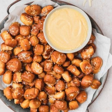 close up of pretzel bites with mustard cheese dip.