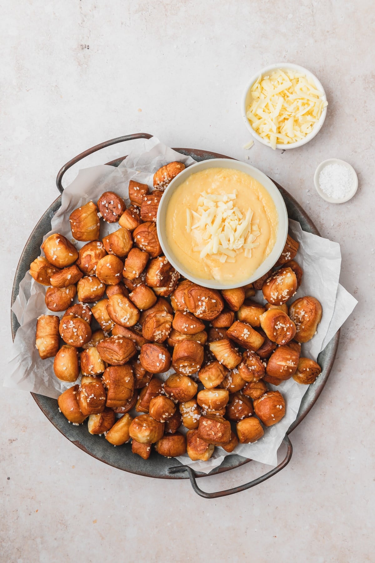 tray of pretzel bites with cheesy mustard dip.