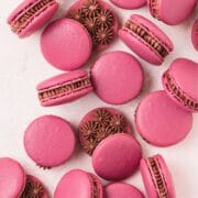 close up of red wine chocolate macarons.