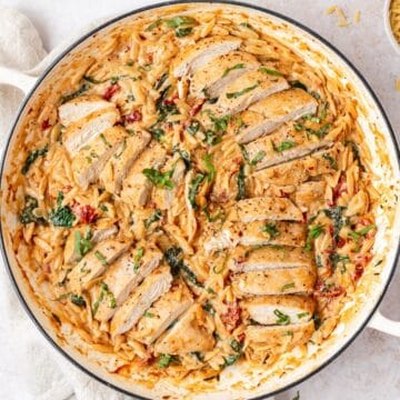 close up of creamy tuscan chicken orzo.
