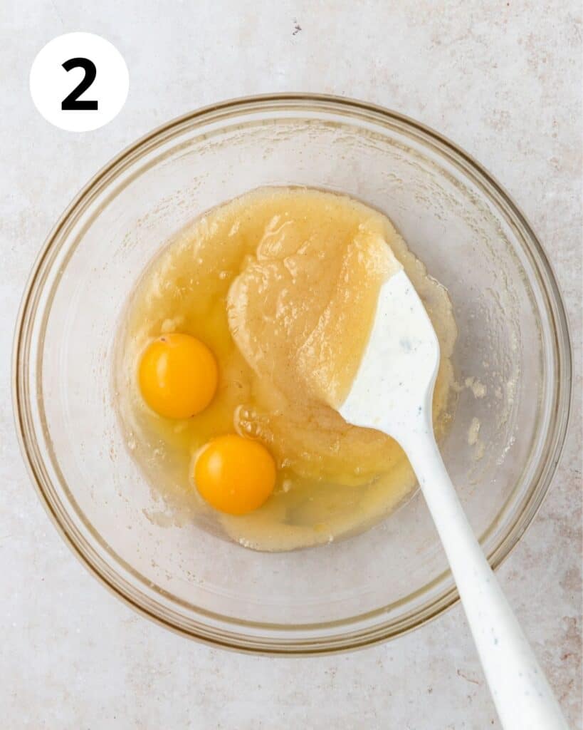 adding in eggs and vanilla bean paste.