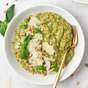 close up of pesto risotto with toasted pine nuts.