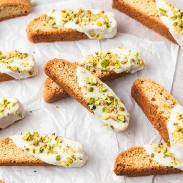 close up of pistachio white chocolate biscotti.