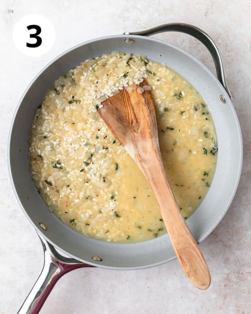 adding in stock to risotto.