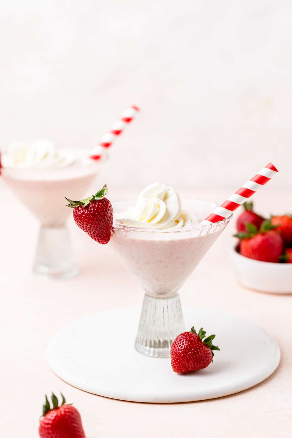 strawberries and cream cocktails in martini glasses.