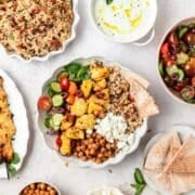 close up of greek chicken bowls with pearl couscous.