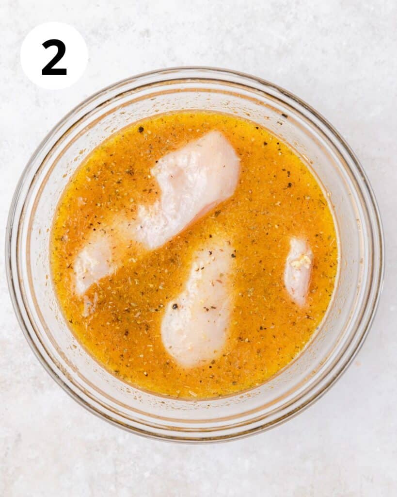marinating chicken breasts in mojo seasoning.