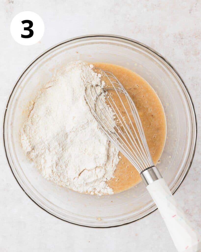 adding dry ingredients to banana muffins.