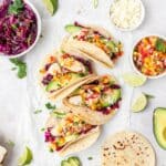 close up of grilled chicken tacos with peach mango salsa.