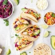 close up of grilled chicken tacos with peach mango salsa.