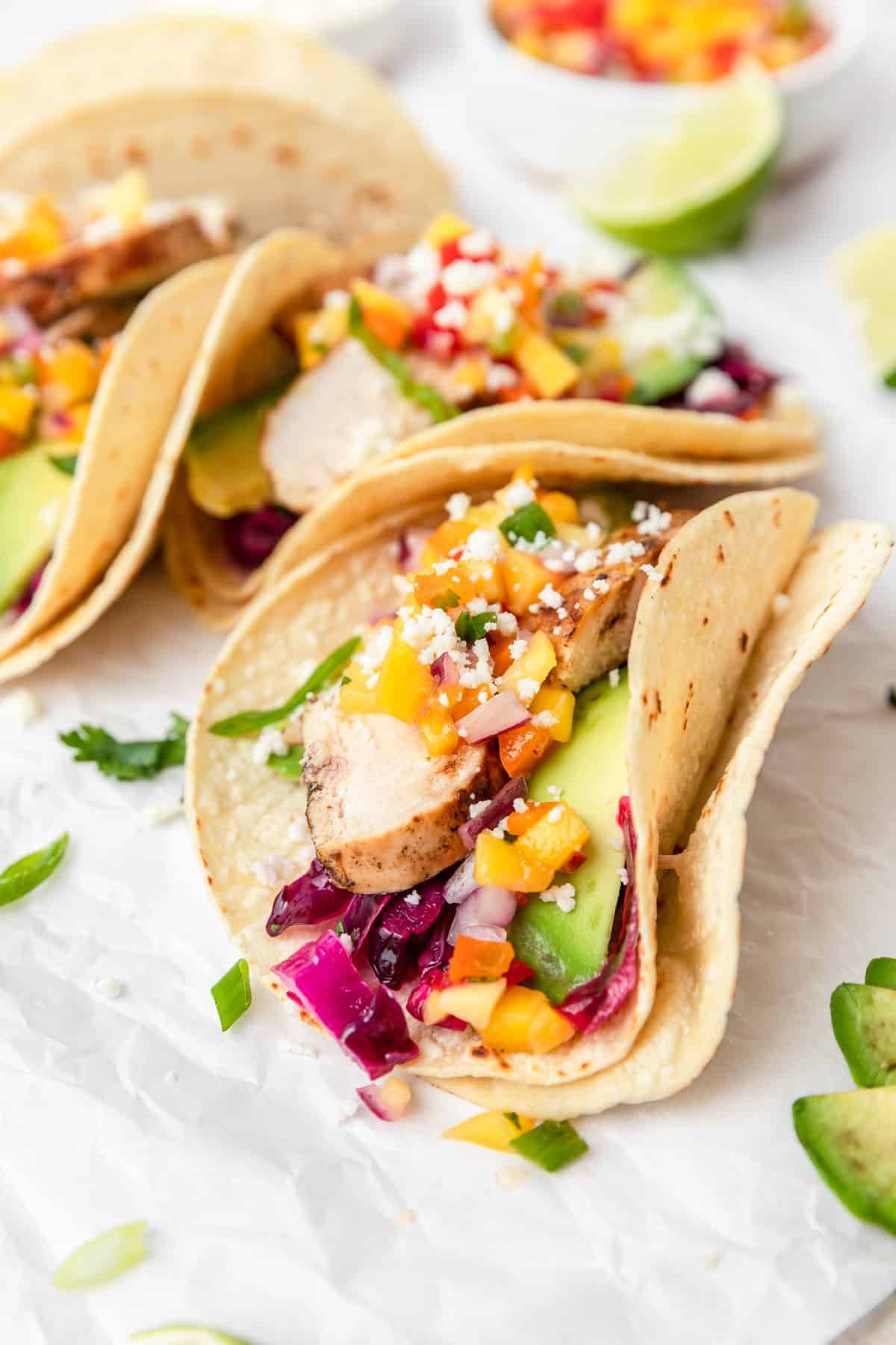 soft tacos with grilled mojo chicken and peach salsa.