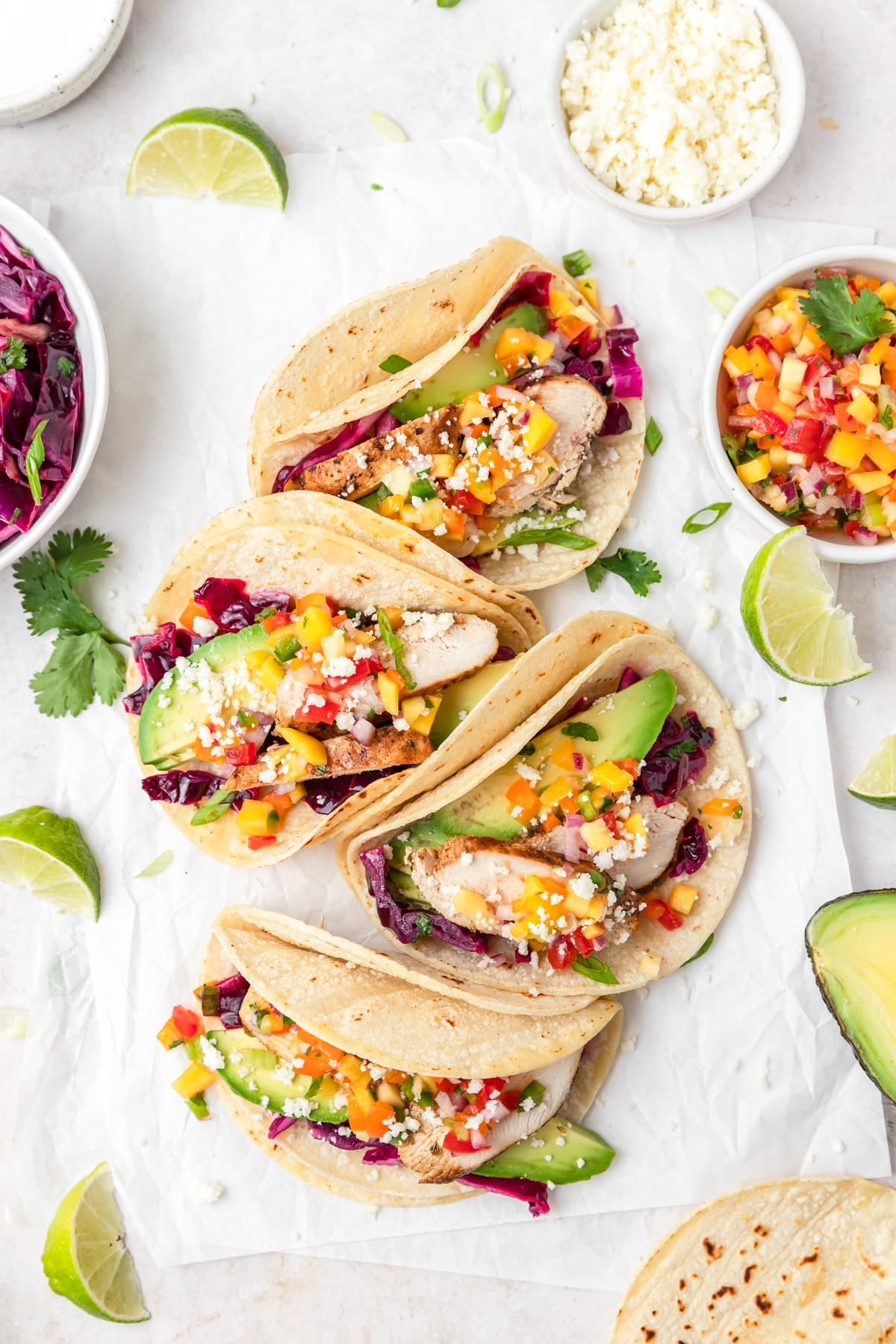 grilled chicken tacos with mango salsa and cabbage slaw.