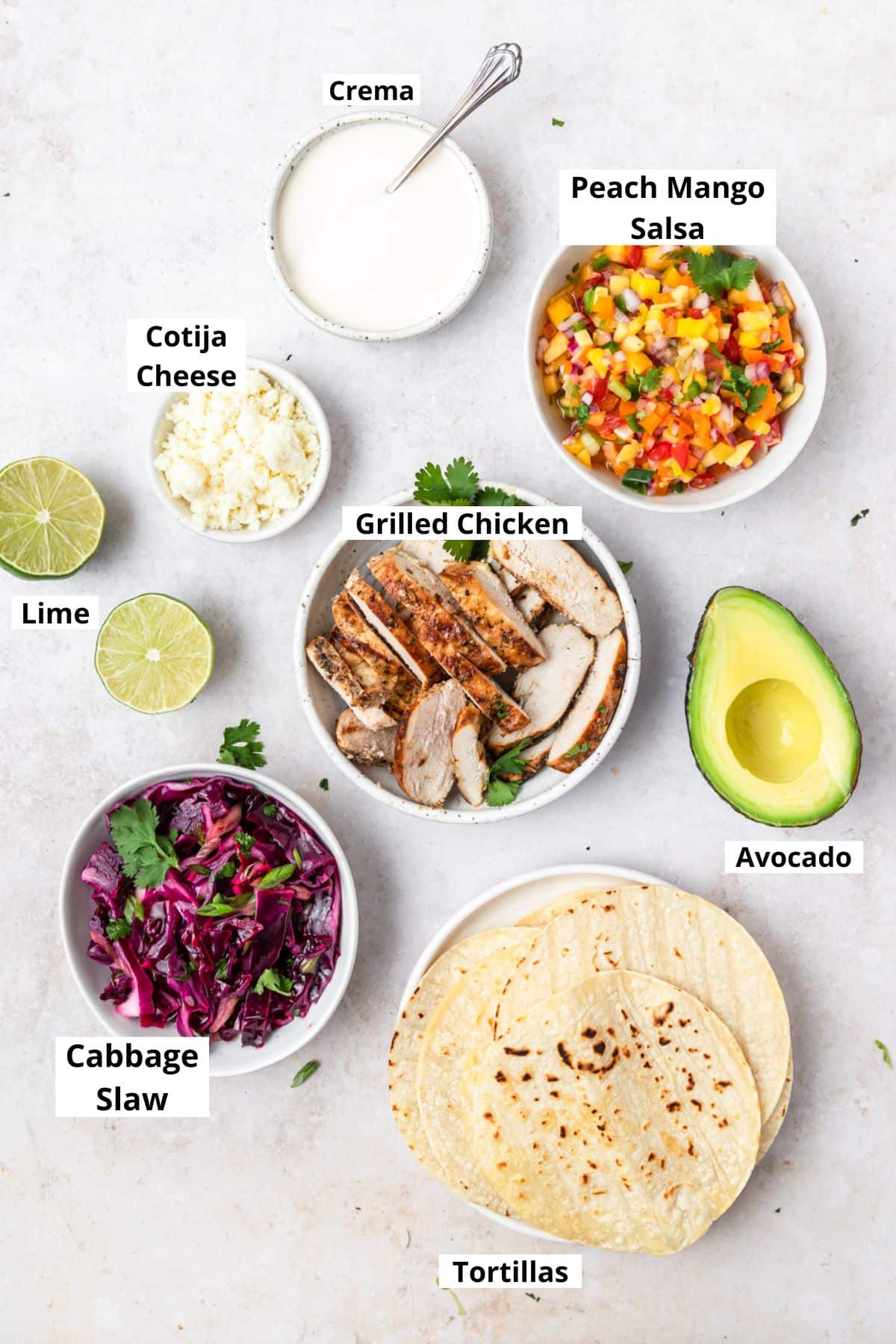 labeled shot of ingredients for grilled chicken tacos with mango salsa.