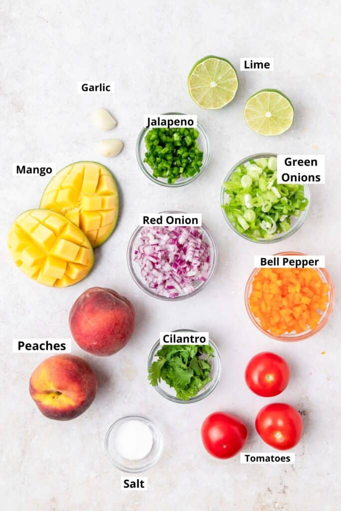 labeled shot of ingredients for peach mango salsa.