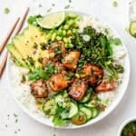 close up of salmon rice bowls with crispy broccoli and avocado.