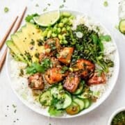 close up of salmon rice bowls with crispy broccoli and avocado.