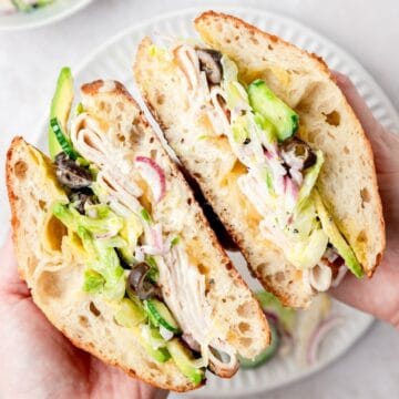closeup of turkey avocado grinder sandwich.