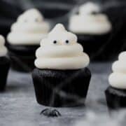 close up of black velvet ghost cupcakes.