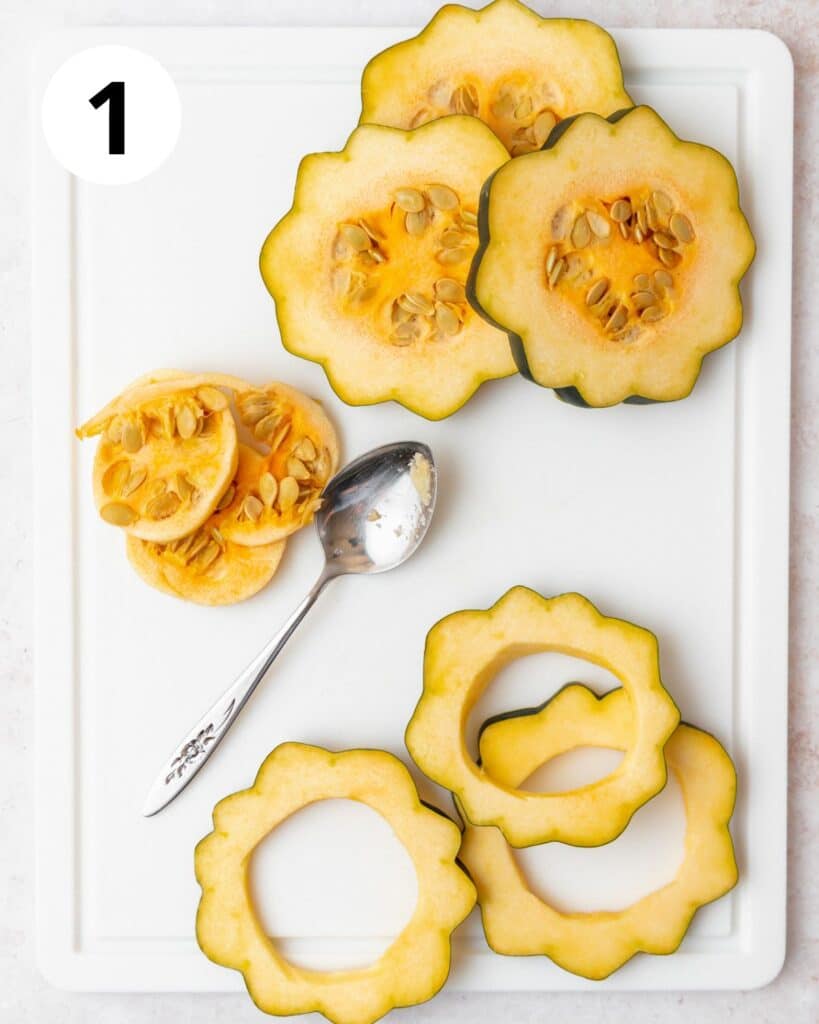 scooping out insides of acorn squash.