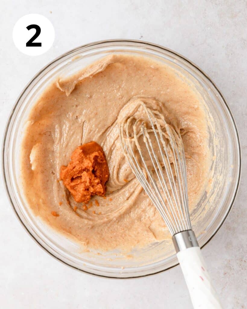 adding egg and pumpkin puree to blondies.