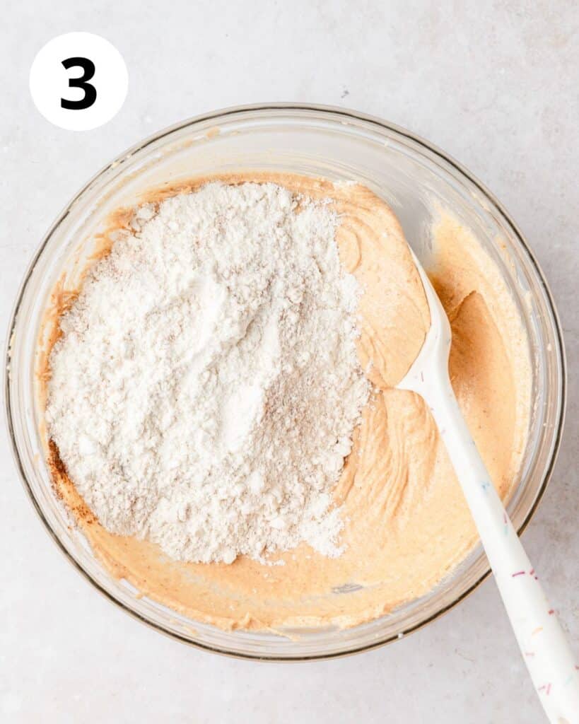 adding dry ingredients to blondies.