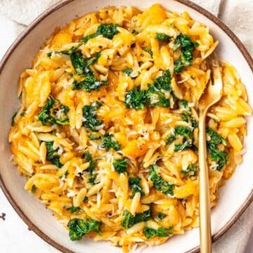 close up of butternut squash orzo with kale.